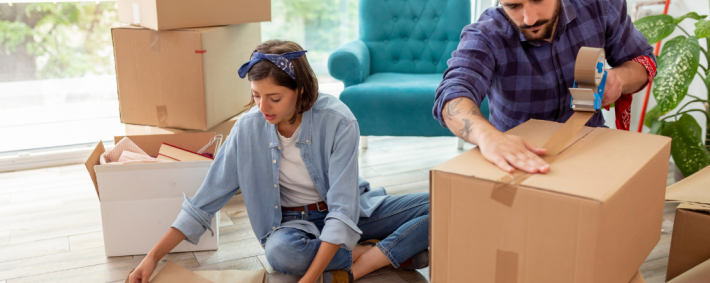 couple packing moving boxes